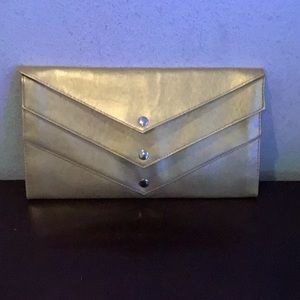 Used women gold clutch in perfect condition